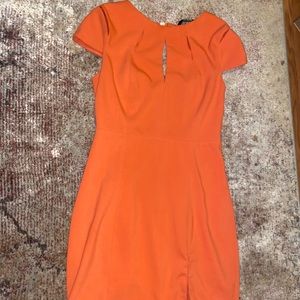 Adorable laser cut, backless, orange dress